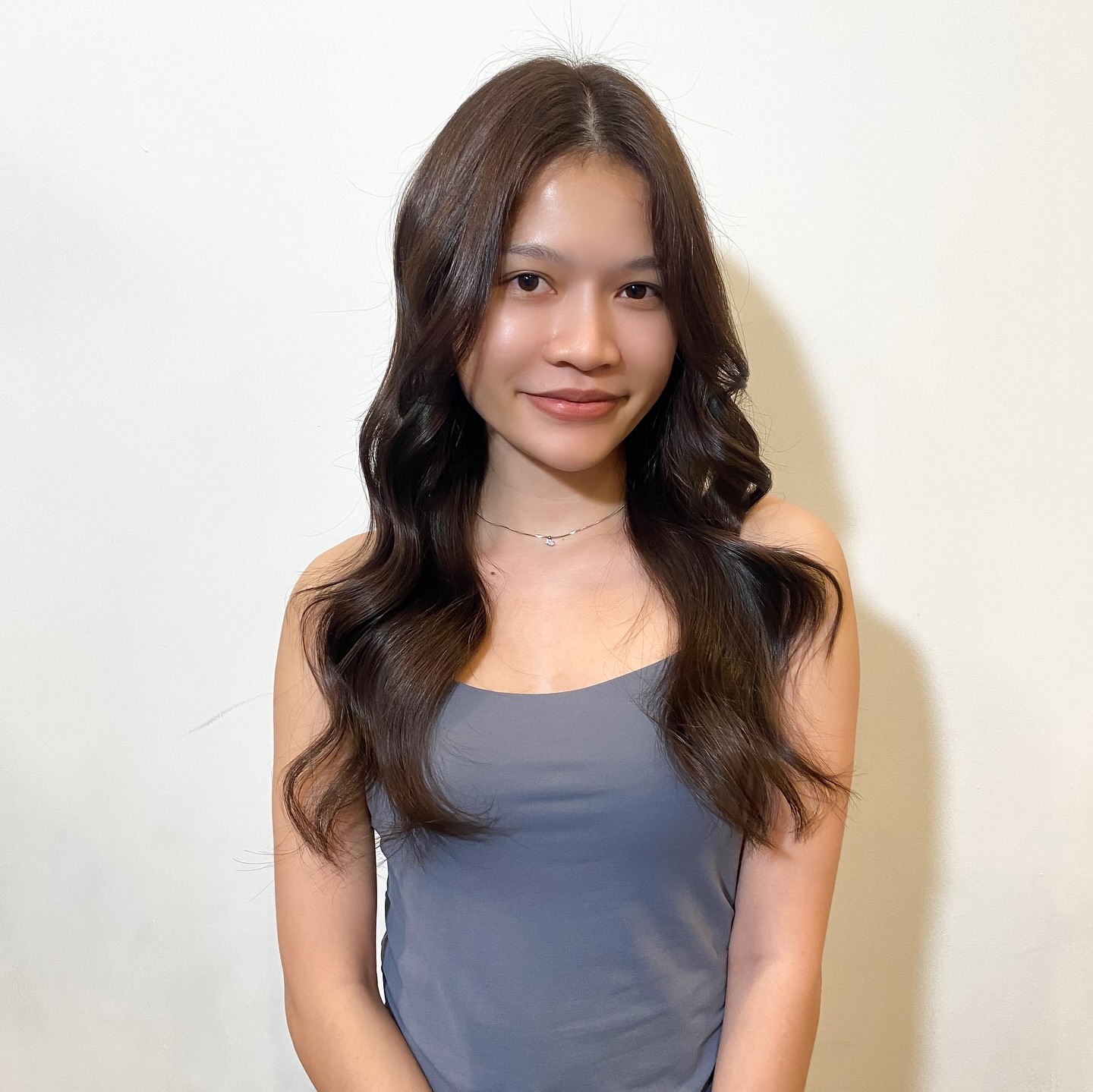 Refined Dark Ash Brown Waves with Sleek Mid-Length Style