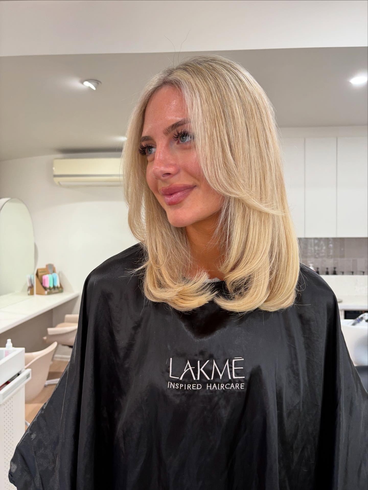 Soft Blonde Feathered Cut with Gentle Flips