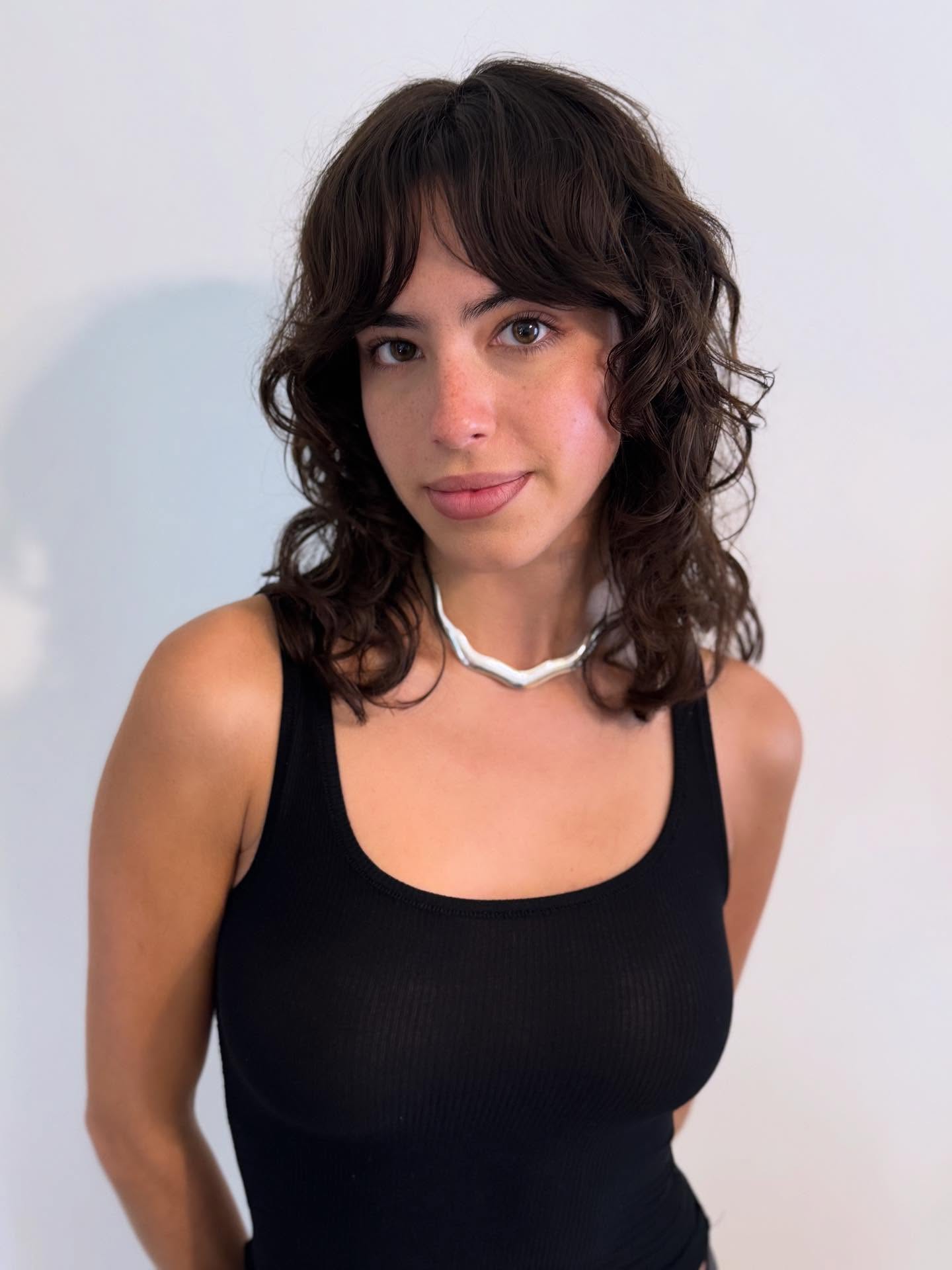 Textured Brunette Waves with Soft Bangs