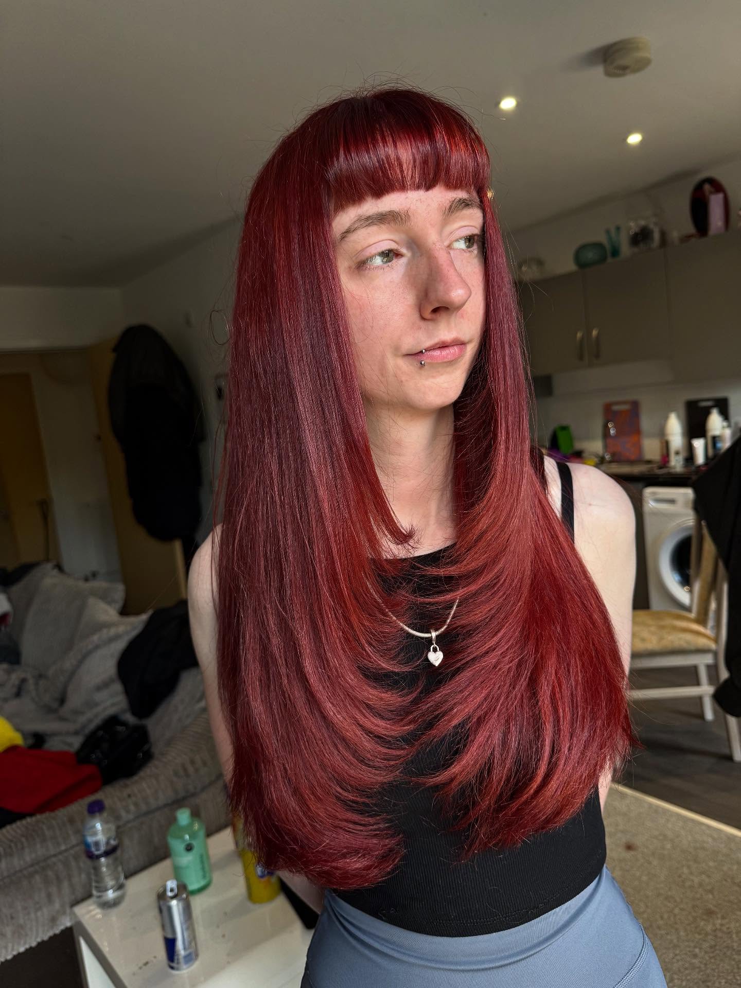 Vibrant Crimson Waves with Sleek Baby Bangs