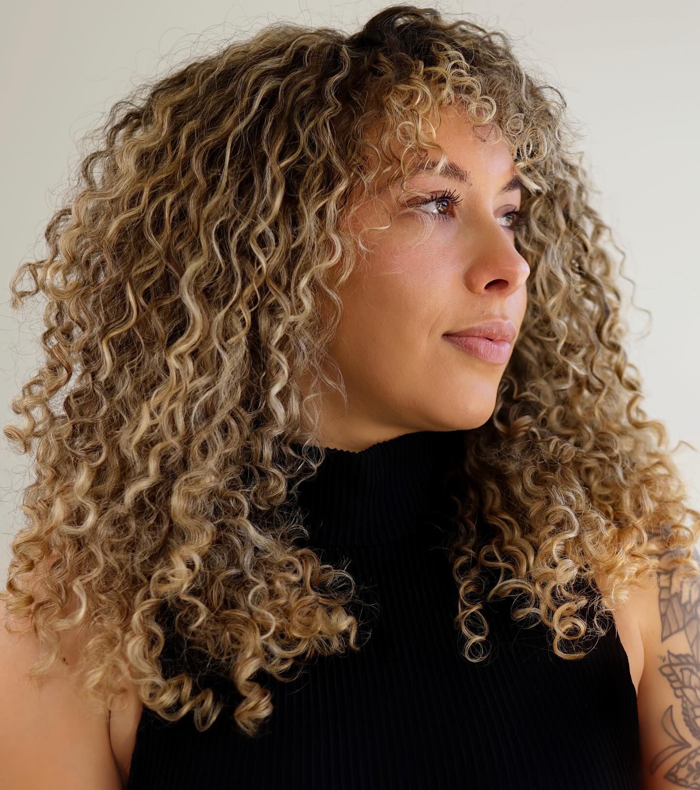 Voluminous Golden Curly Cascade