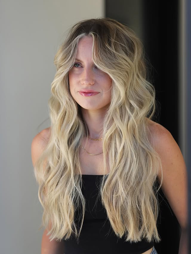 Whimsical Blonde Waves with Luminous Face-Framing Highlights