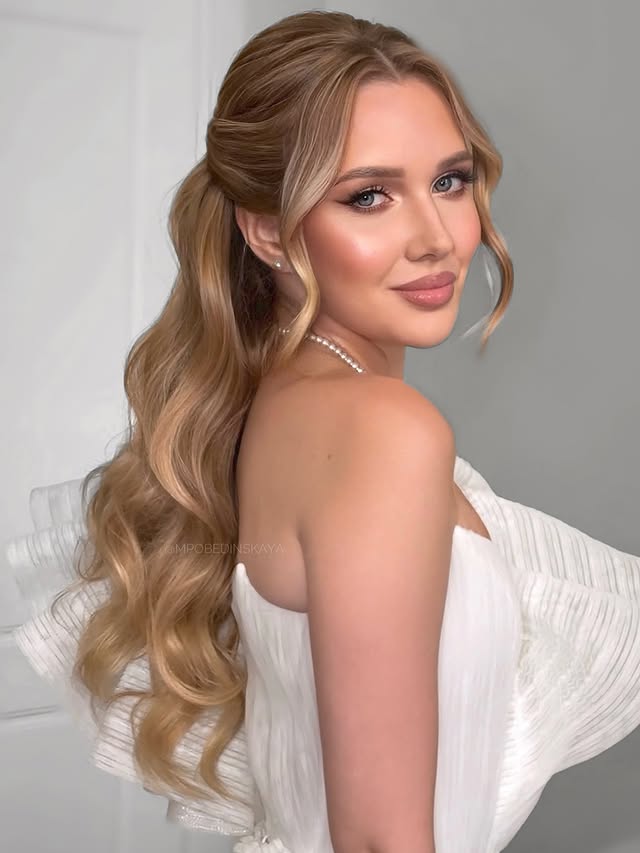 Elegant Cascading Curls with a Crown Twist