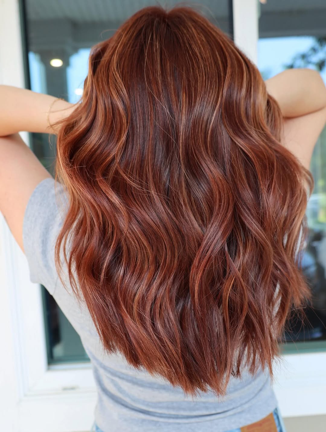 Flowing Chestnut Waves with Subtle Blonde Highlights