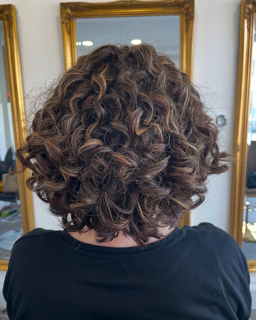 Playful Curly Layered Cut with Luscious Volume