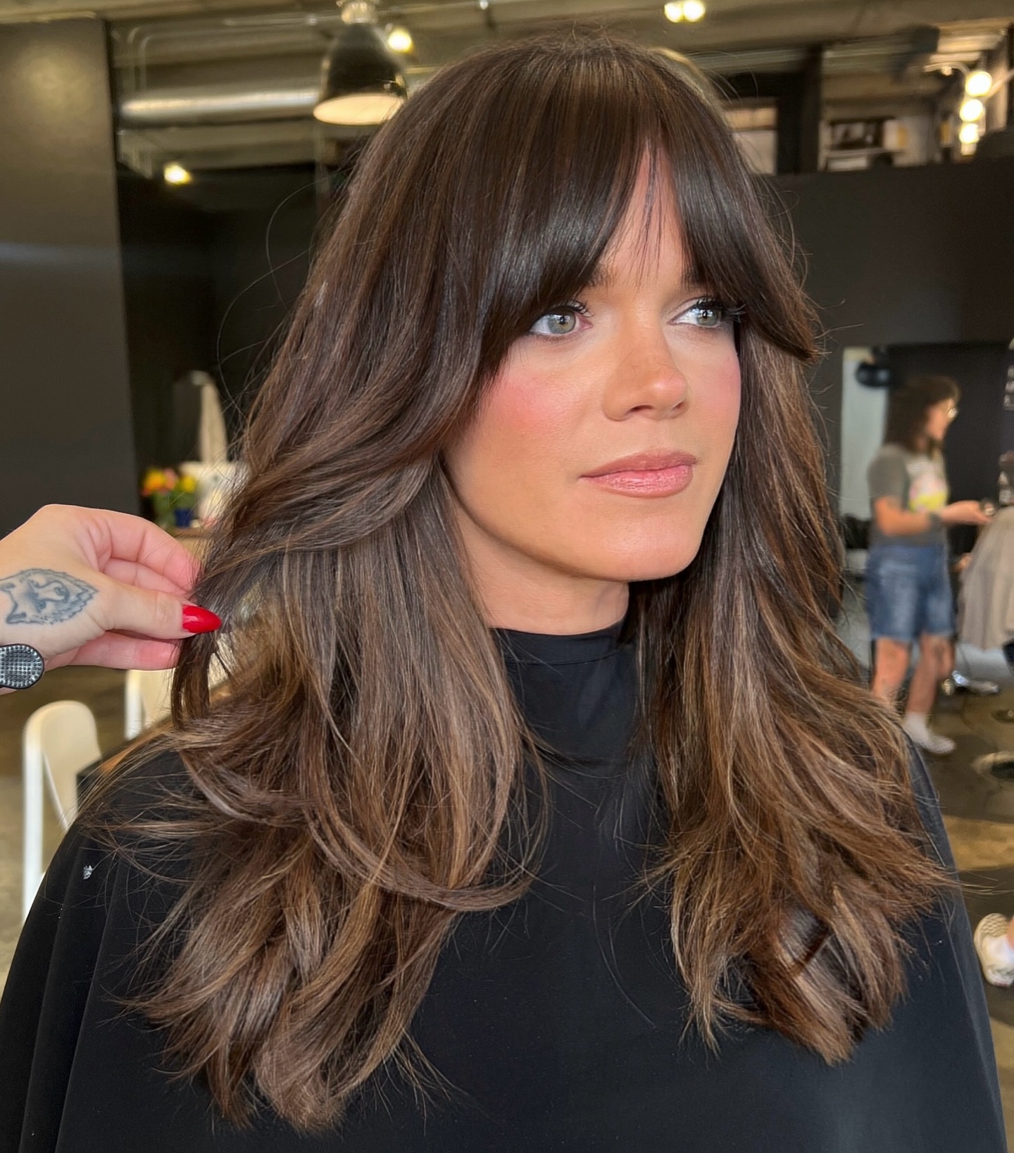 Radiant Chestnut Layers with Face-Framing Bangs