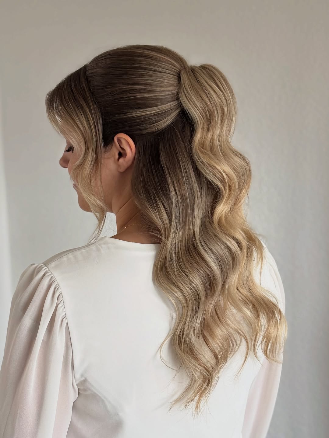 Radiant Soft Waves with Polished Half-Up Style