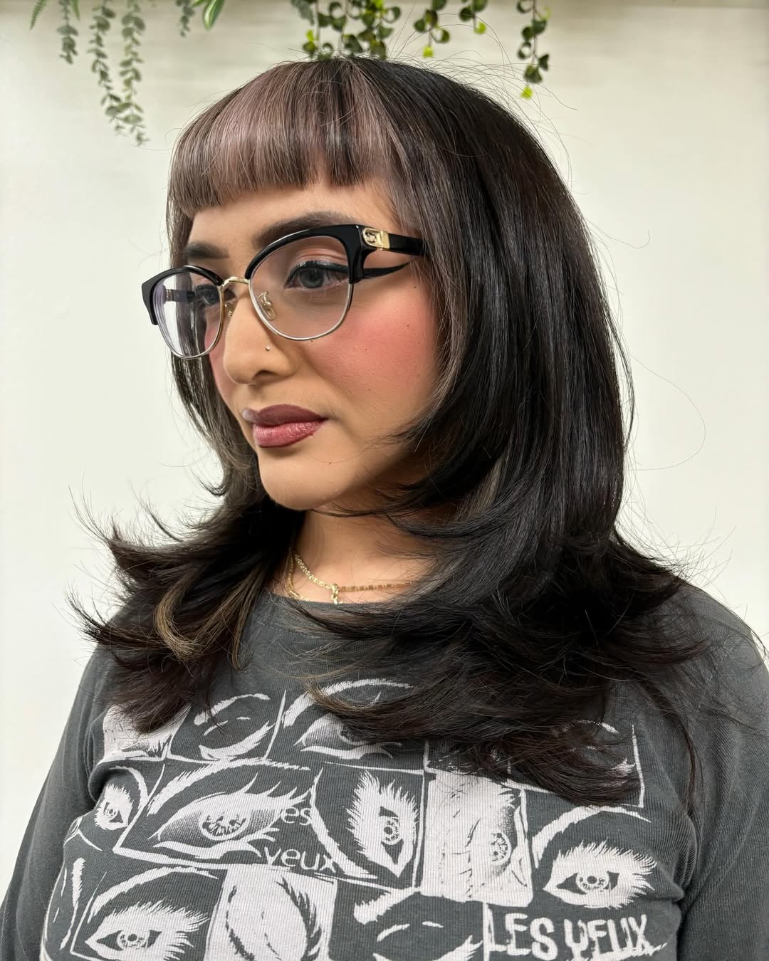Sleek Chestnut Bob with Curled Ends and Full Bangs