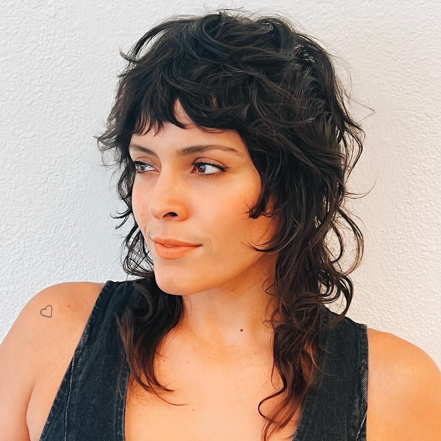 Artfully Tousled Curly Mullet with Cascading Bangs