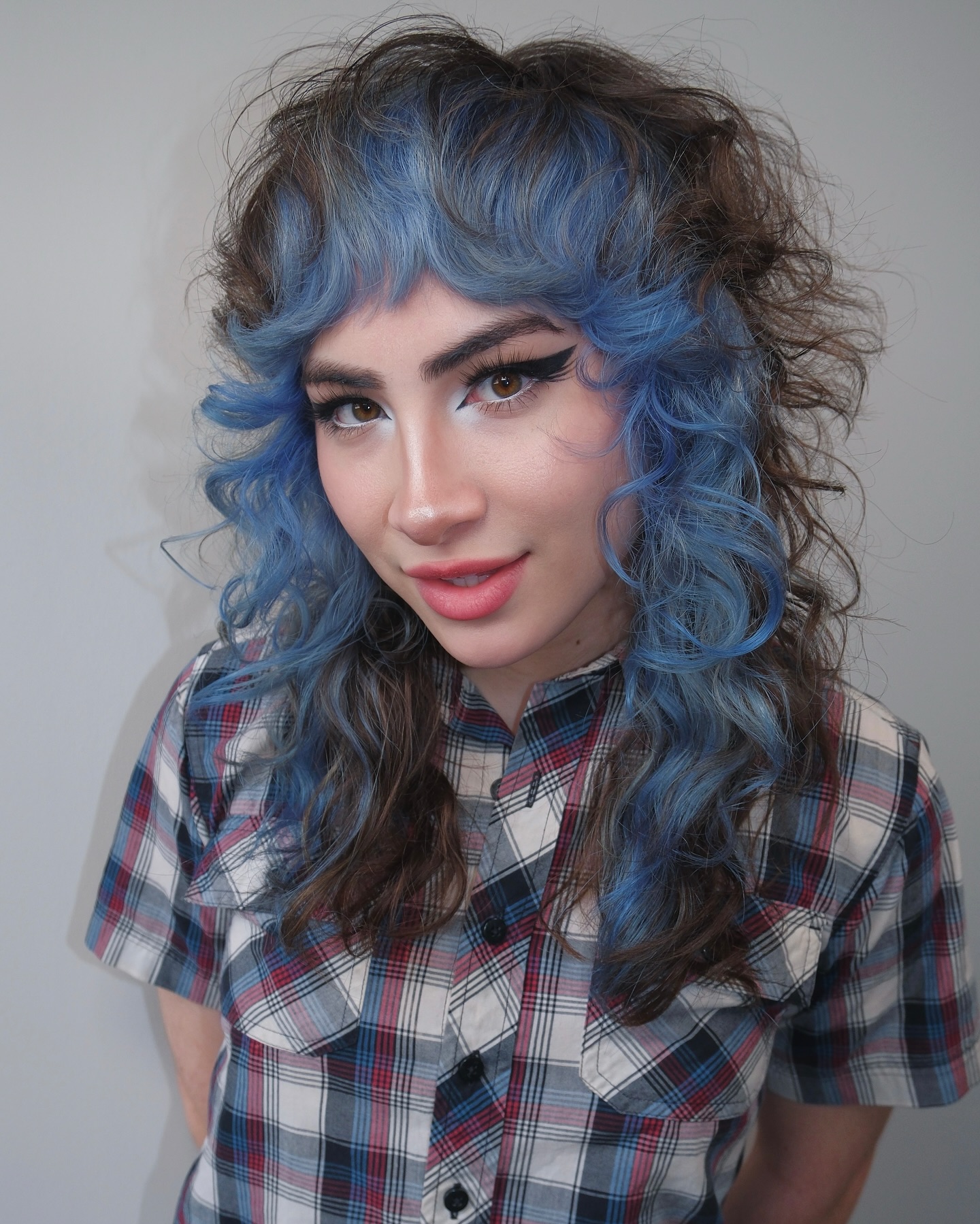 Bold Blue Curly Mullet with Soft Bangs