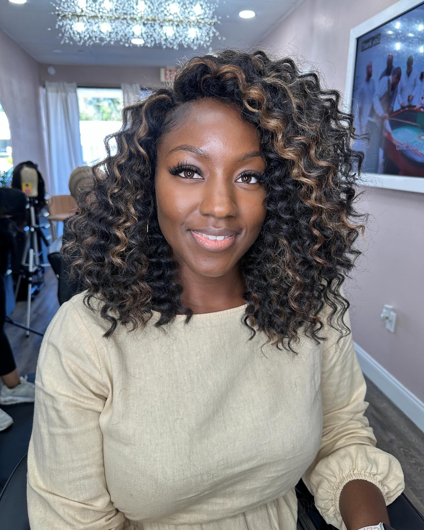 Cascading Chestnut Curls with Blonde Highlights