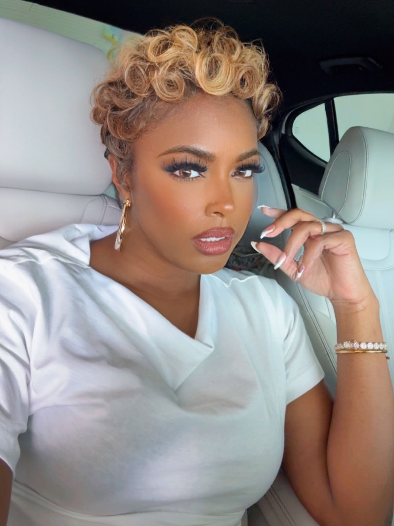 Dynamic Blonde Tousled Curls with Tapered Sides