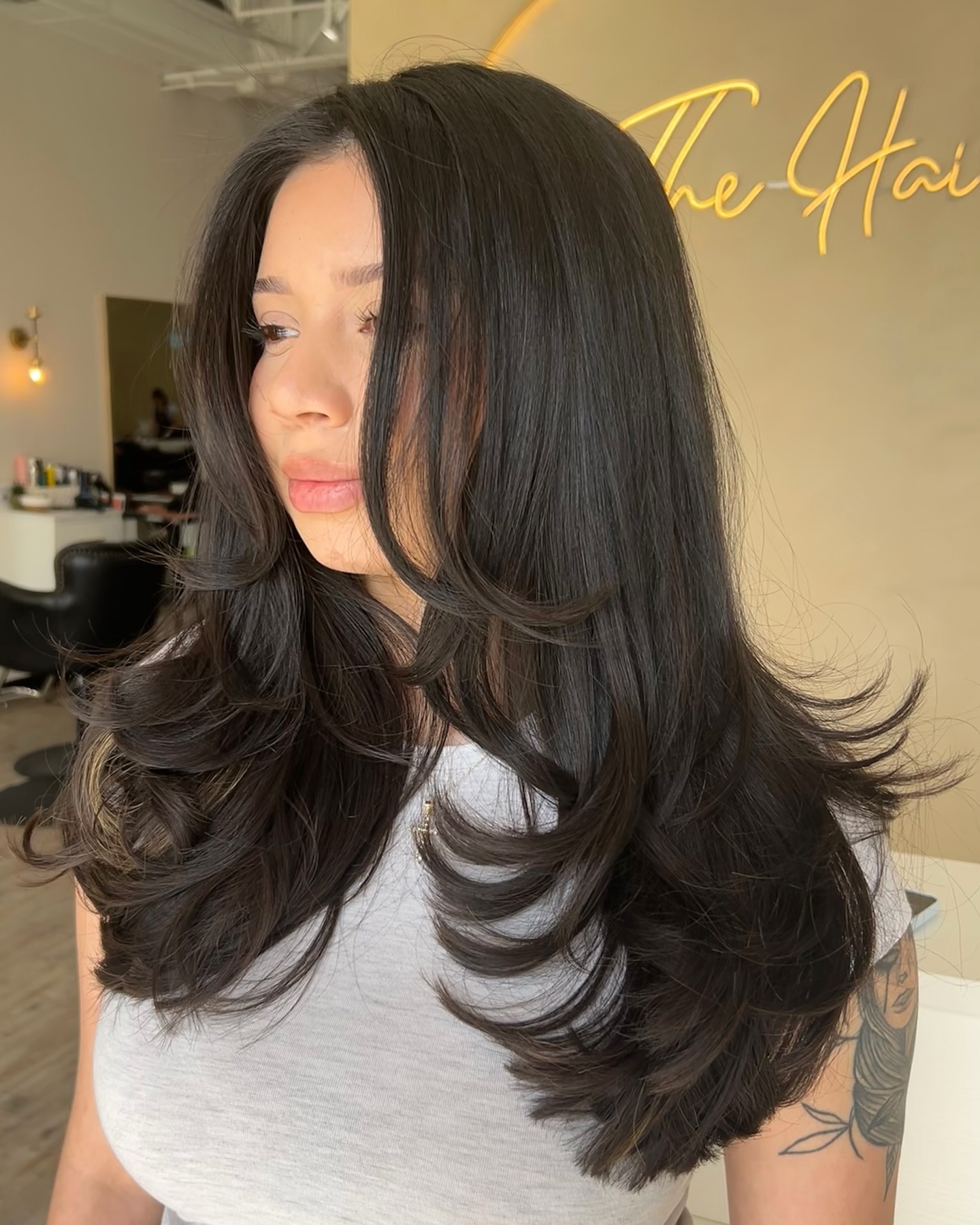 Elegant Dark Layered Waves with Glossy Finish