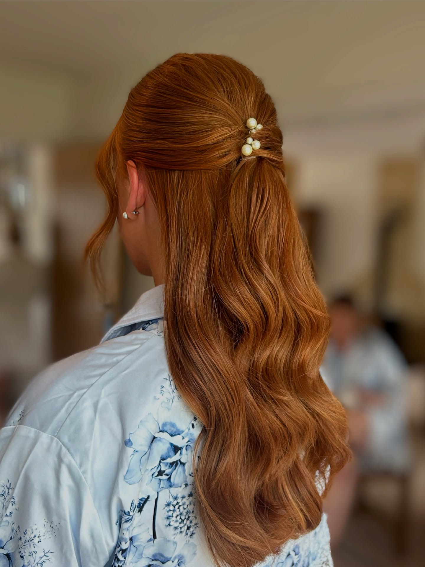 Luxurious Copper Half-Updo with Pearl Accents