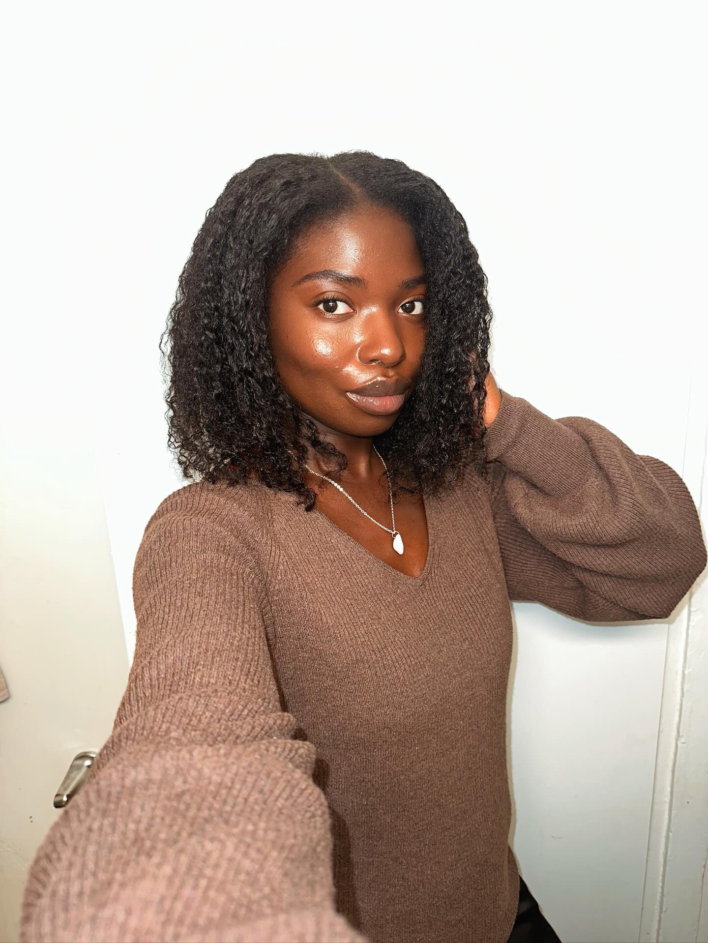 Natural Ebony Curls with Luminous Glow