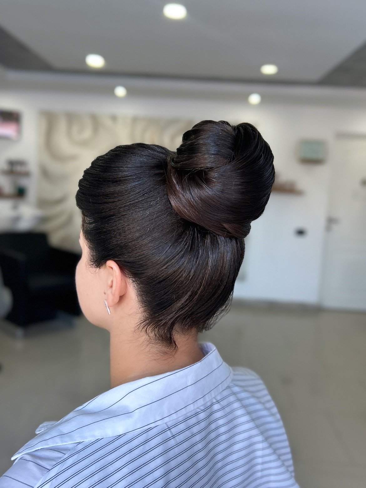 Elegant Tucked-in Bun with Glossy Finish