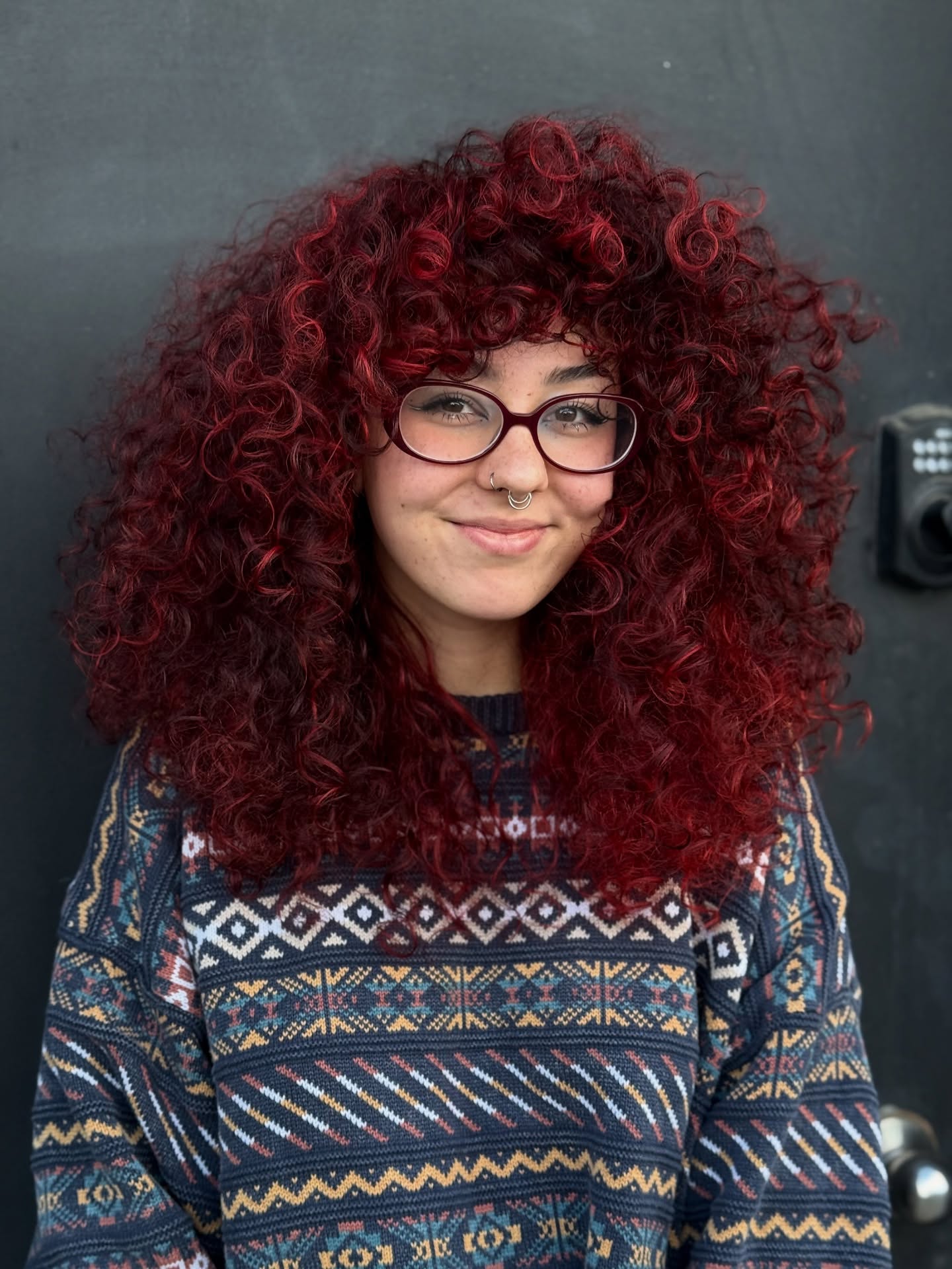 Fiery Red Dense Curls with Playful Volume