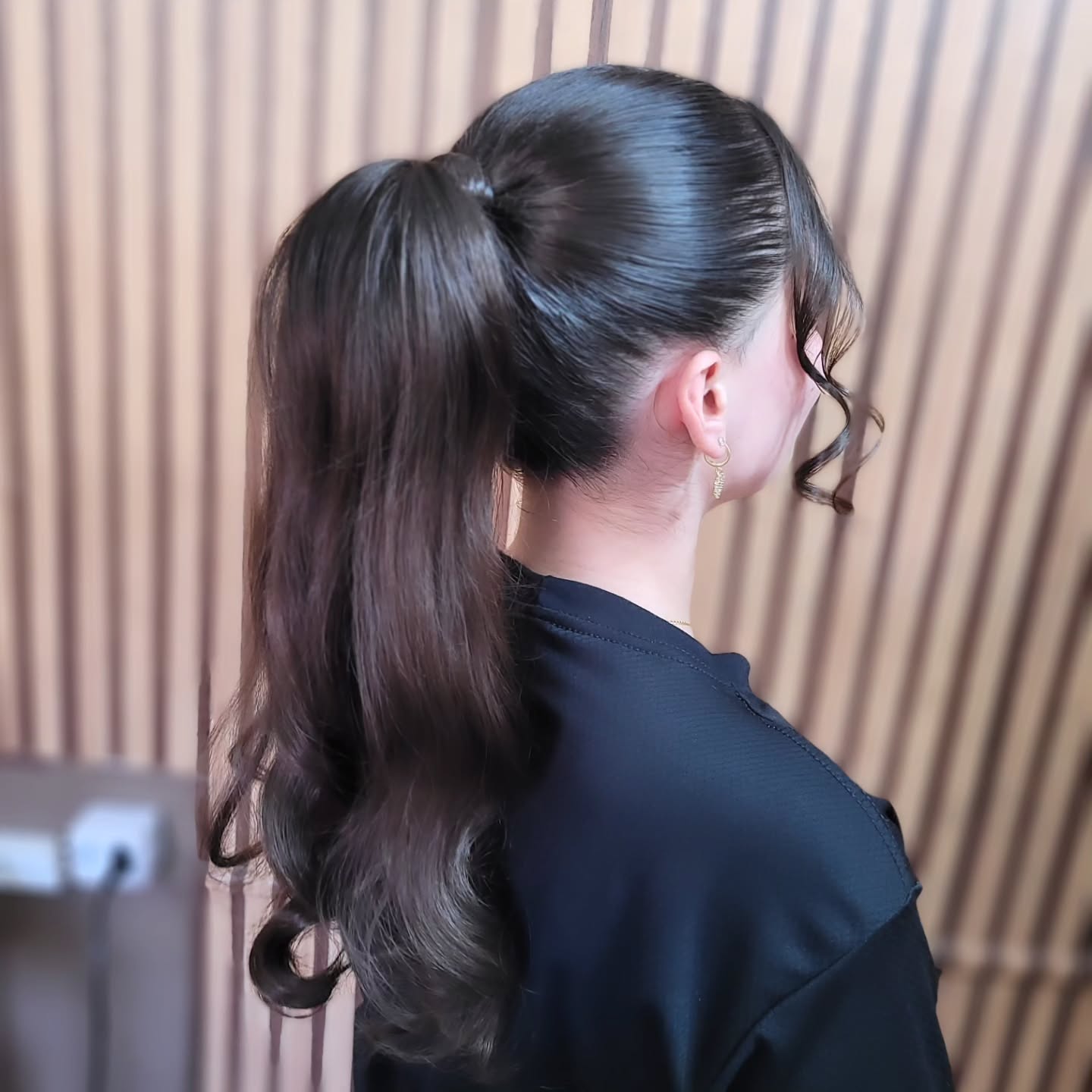Polished High Ponytail with Cascading Curls