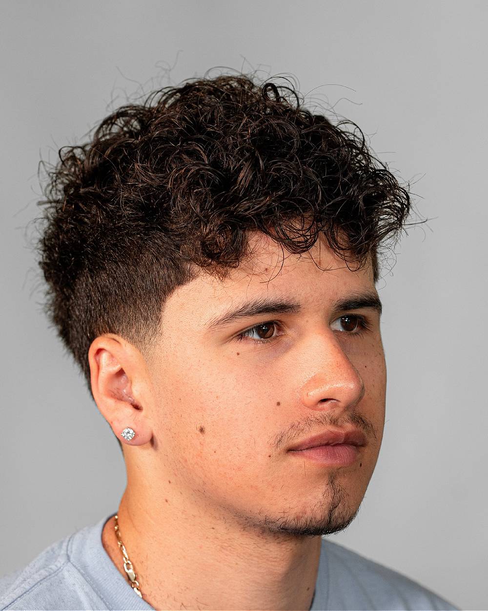 Textured Curly Top with Tapered Sides