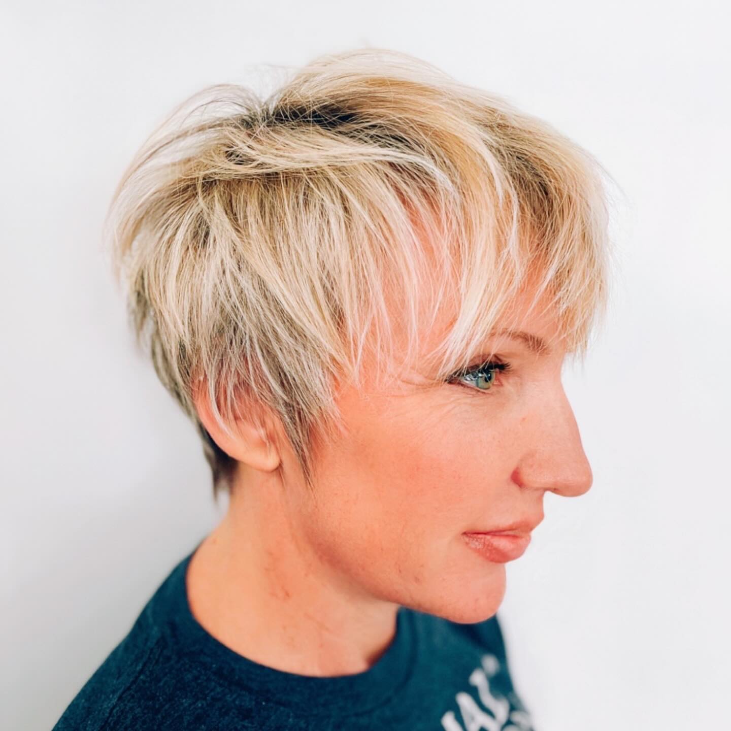 Dynamic Blonde Textured Pixie with Tapered Sides