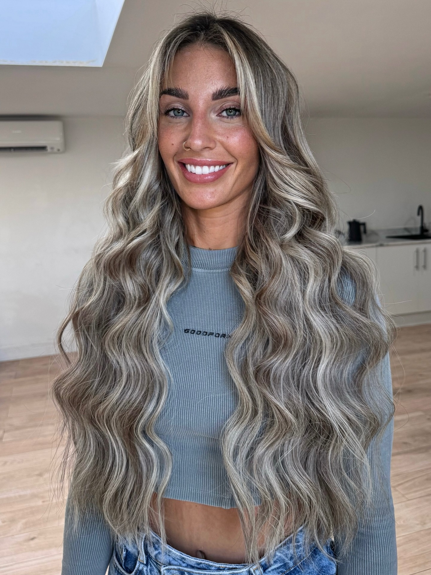 Luxurious Ash Blonde Waves with Face-Framing Highlights