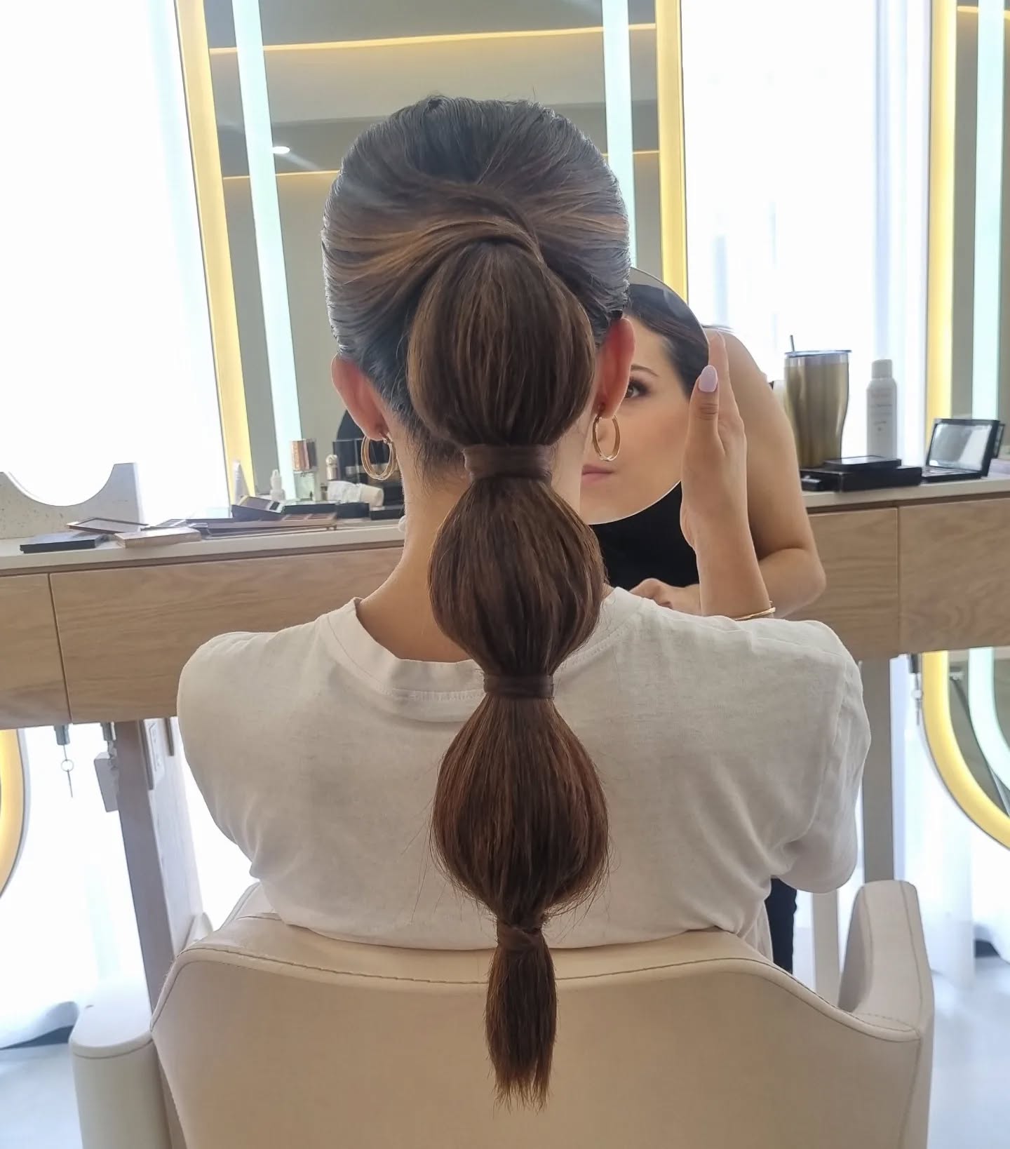 Sleek Knotted Low Ponytail with Volume