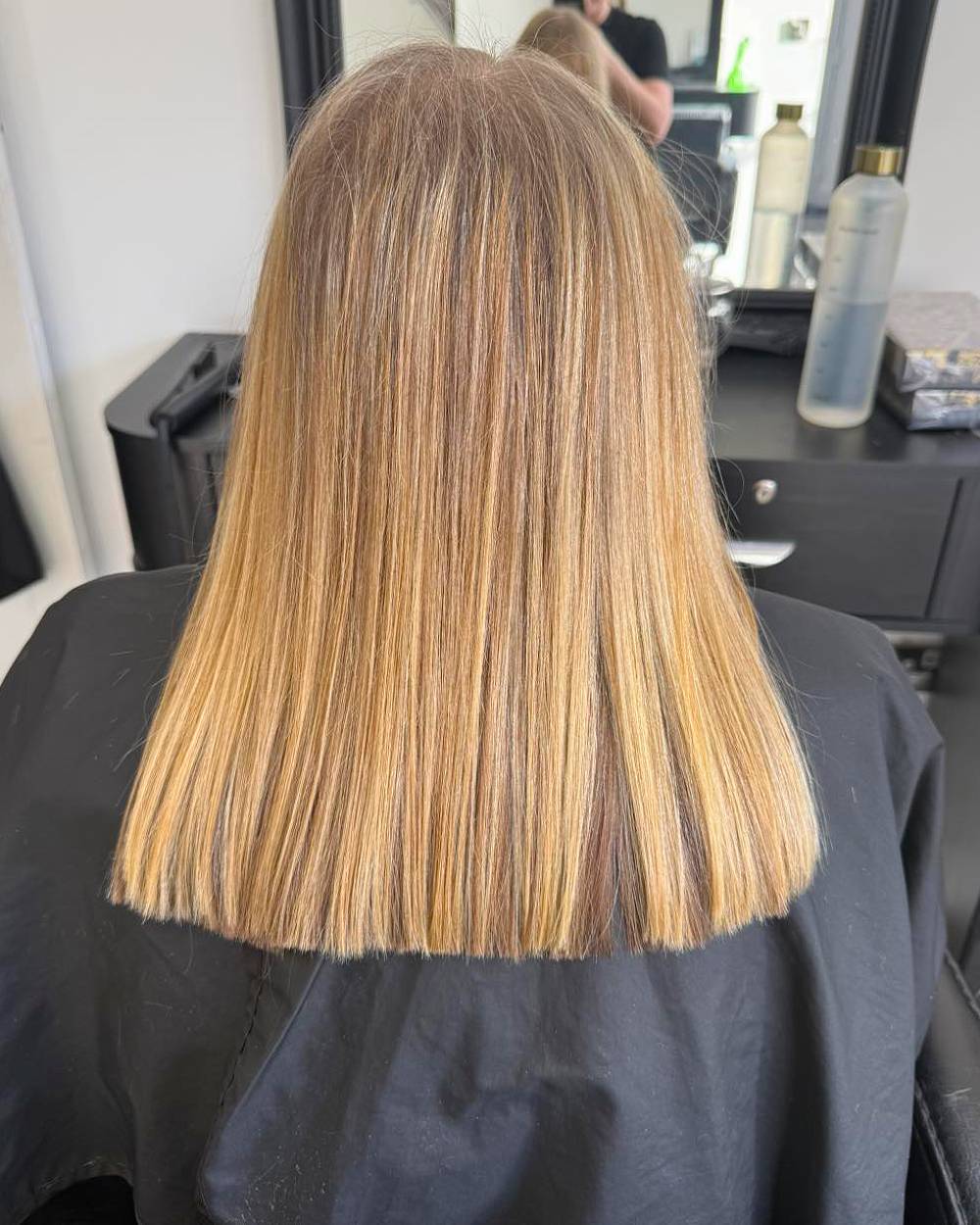 Sleek Straight Cut with Subtle Caramel Highlights