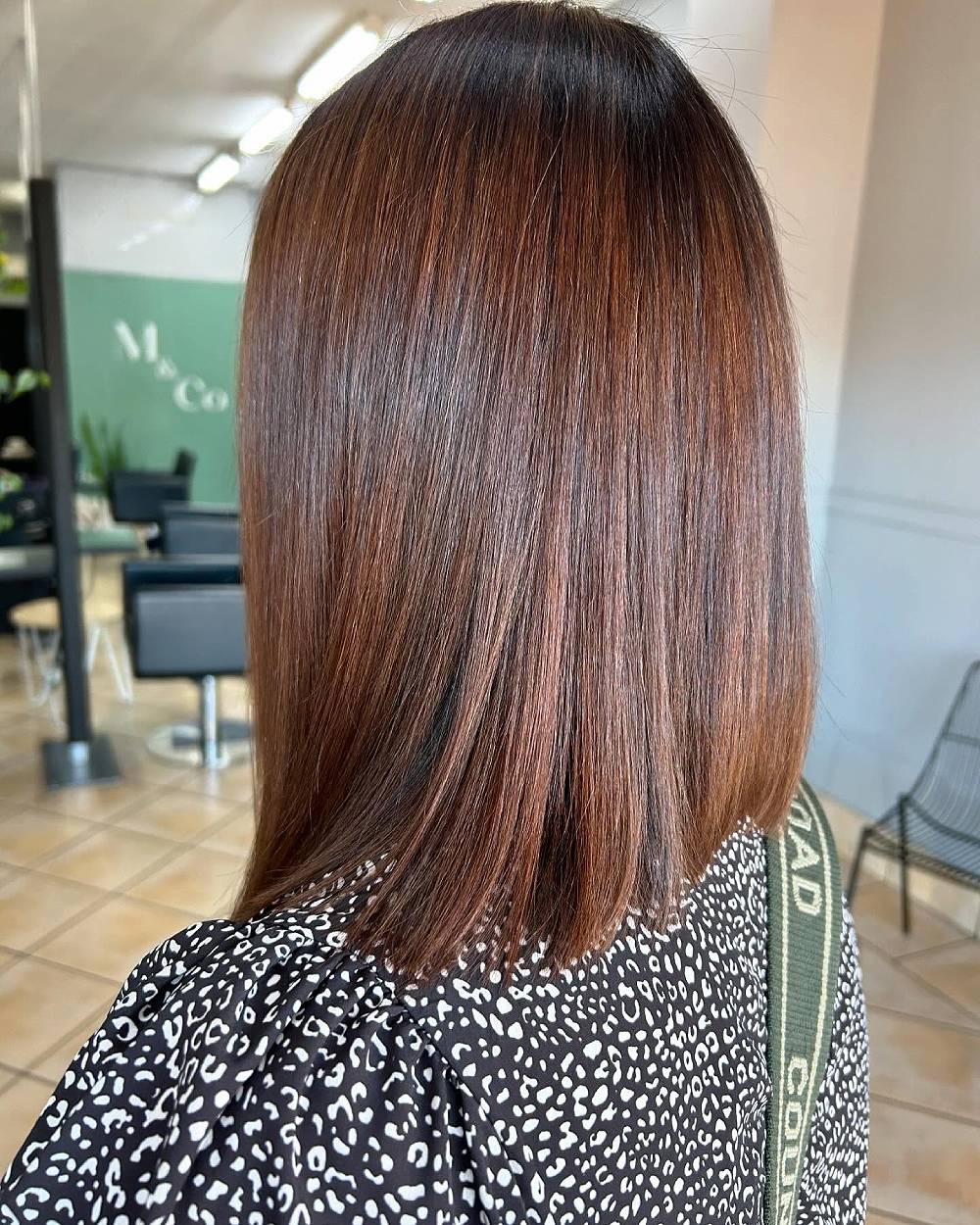 Sleek Straight Lob with Warm Chestnut Tones