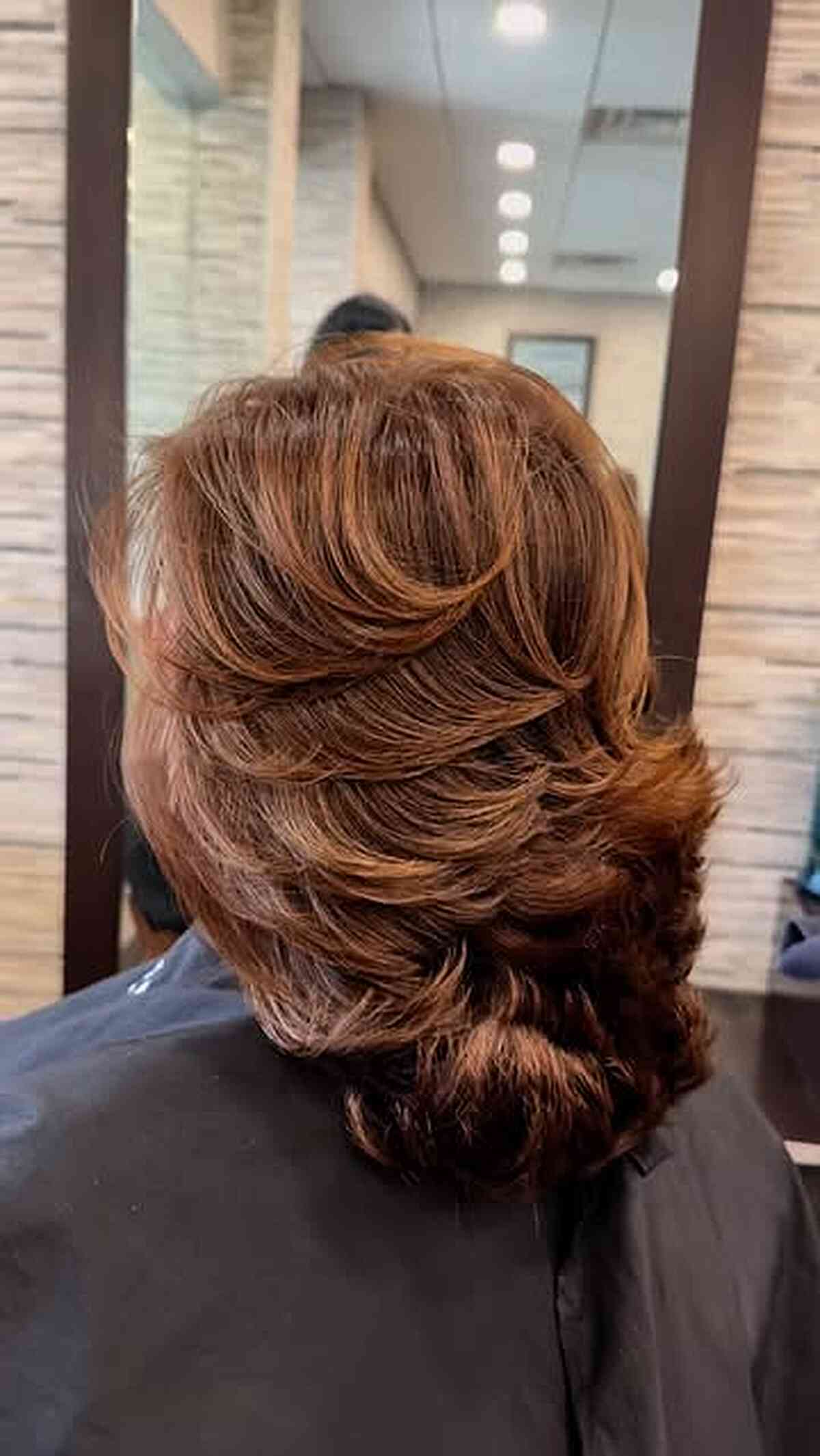 Stylish Feathered Haircut with Soft Layers