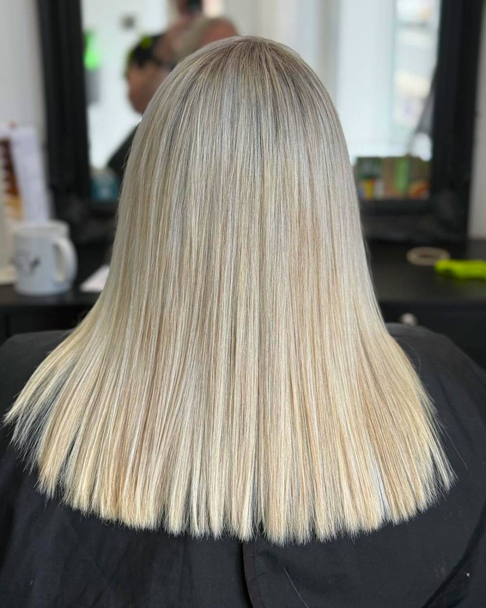 Elegant Long Straight Hair with Subtle Platinum Highlights