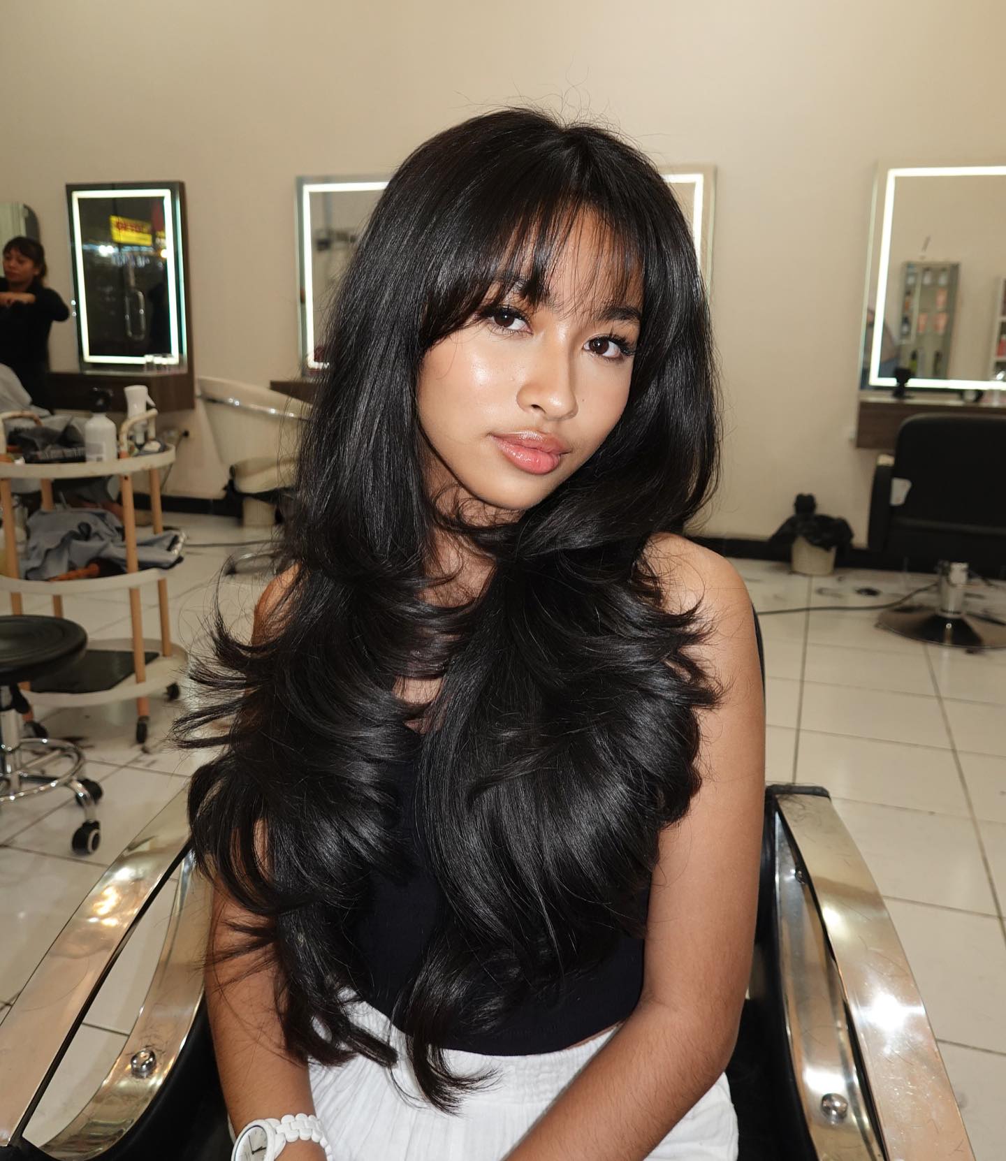 Flowing Ebony Layers with Soft Bangs