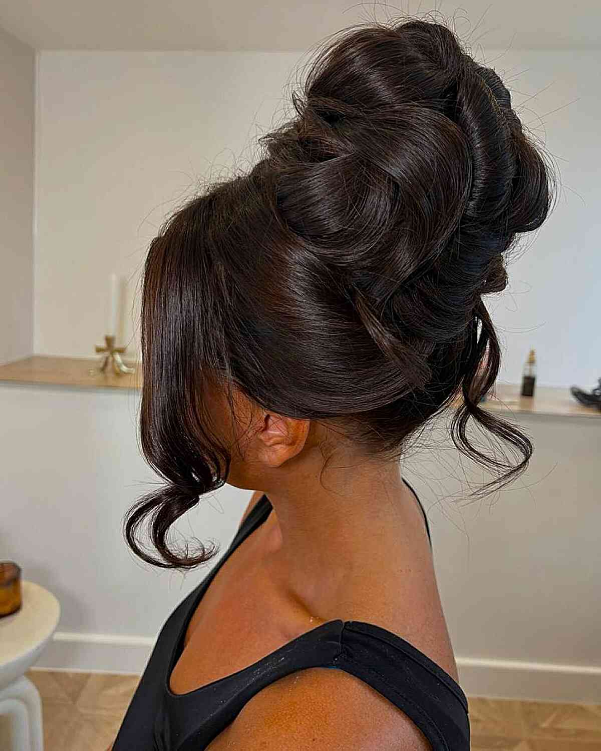 Elegant High Bun with Face-Framing Curls