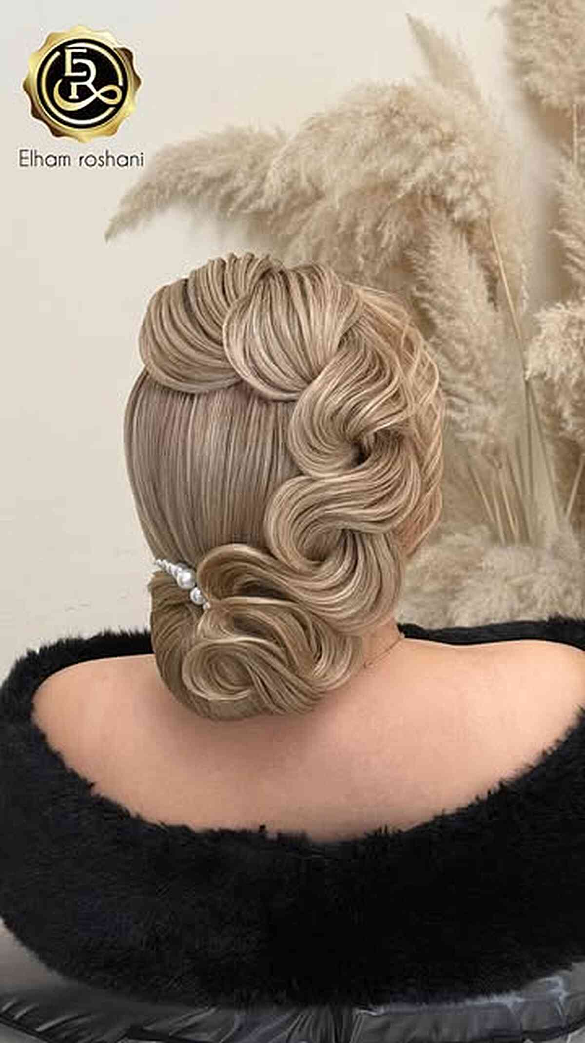 Elegant Sculpted Updo with Soft Waves
