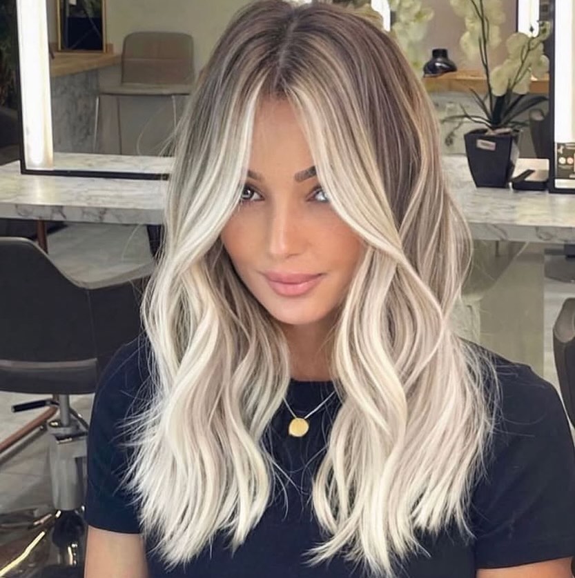 Icy Blonde Waves with Face-Framing Layers
