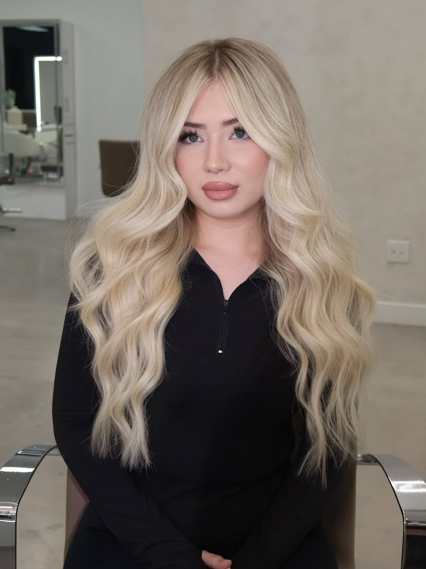 Long Cascading Blonde Waves with Subtle Roots