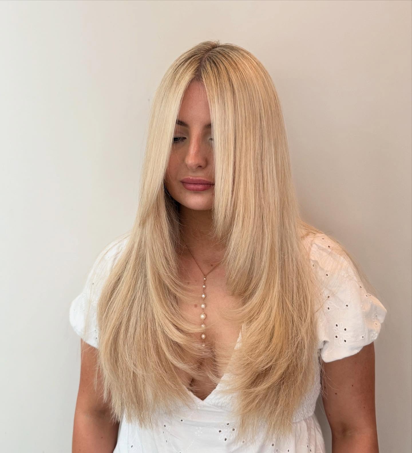 Long-Layered Vanilla Blonde Smooth Cut