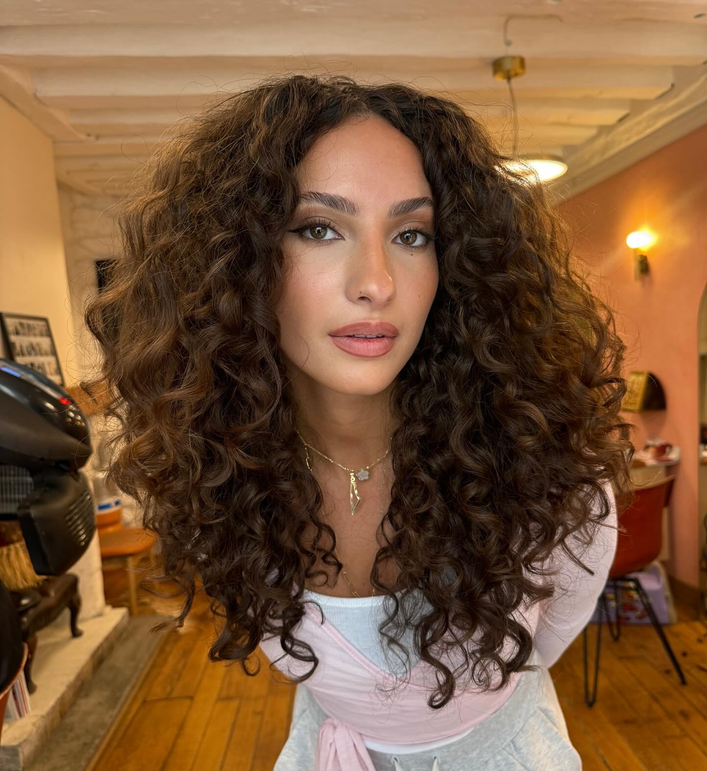 Lush Brunette Curls with Soft Balayage Accents