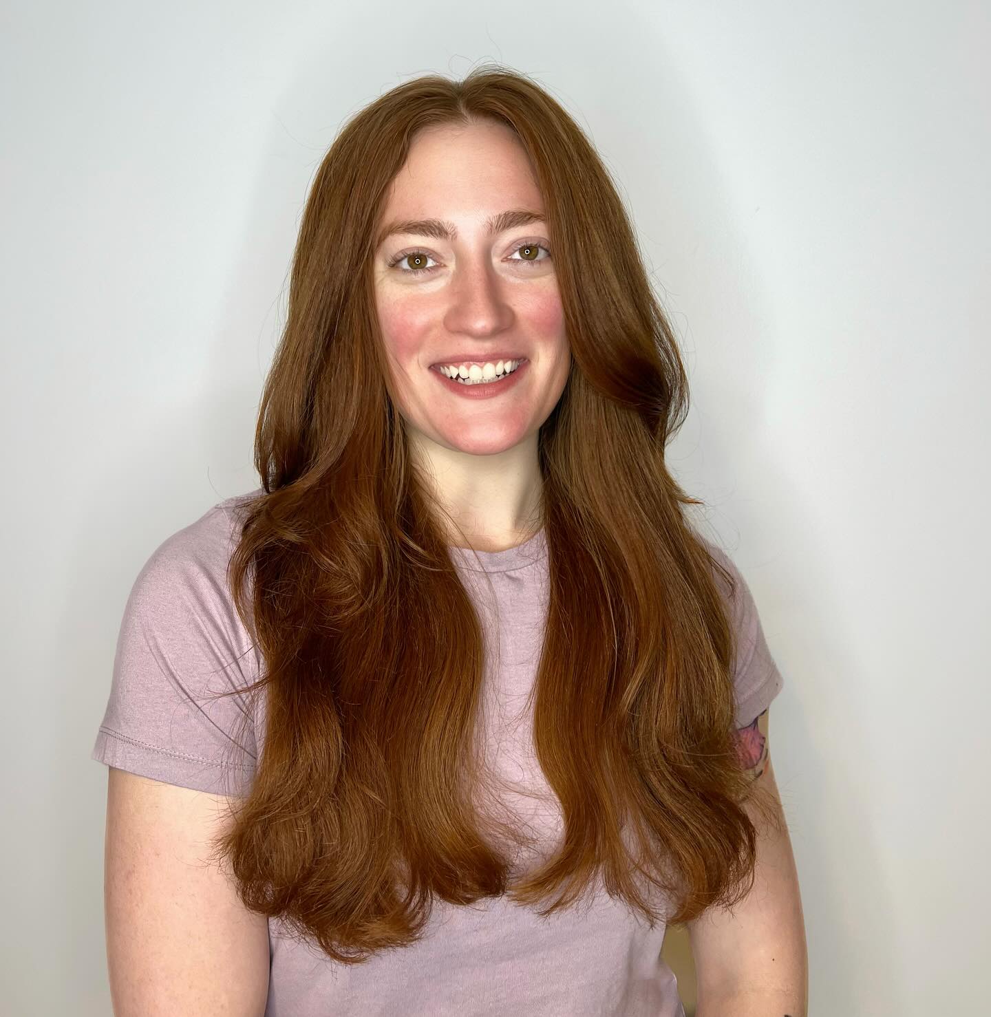 Luxurious Cinnamon Tresses with Voluminous Cascading Layers