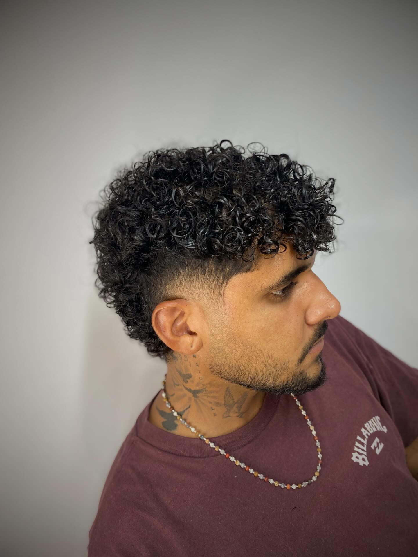 Refined Tousled Curls with Soft Graduated Fade