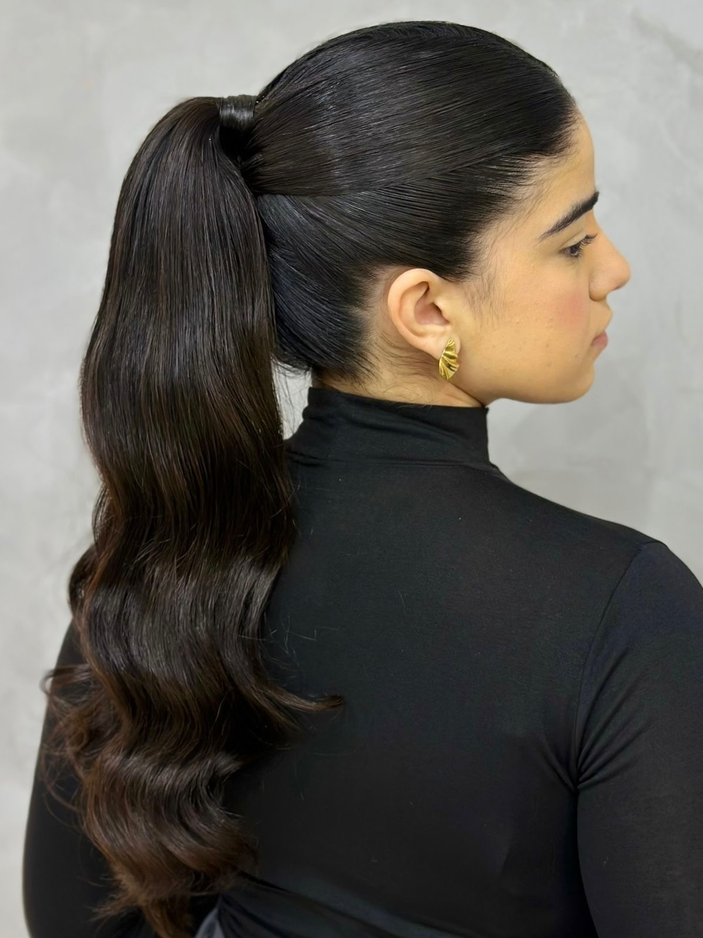 Sleek High Ponytail with Cascading Waves