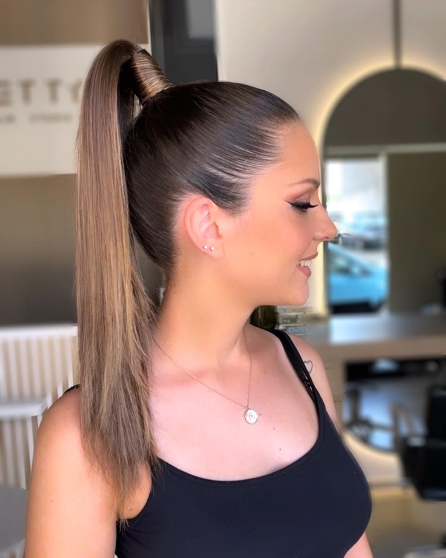 Sleek Polished Ponytail with a Twist