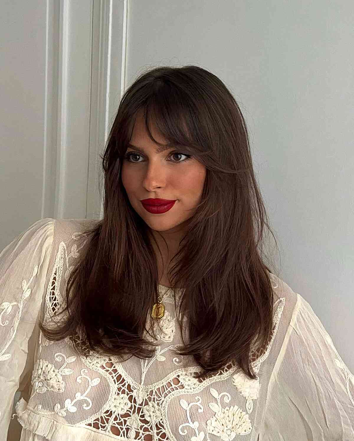 Stylish Brown Layered Haircut with Curtain Bangs