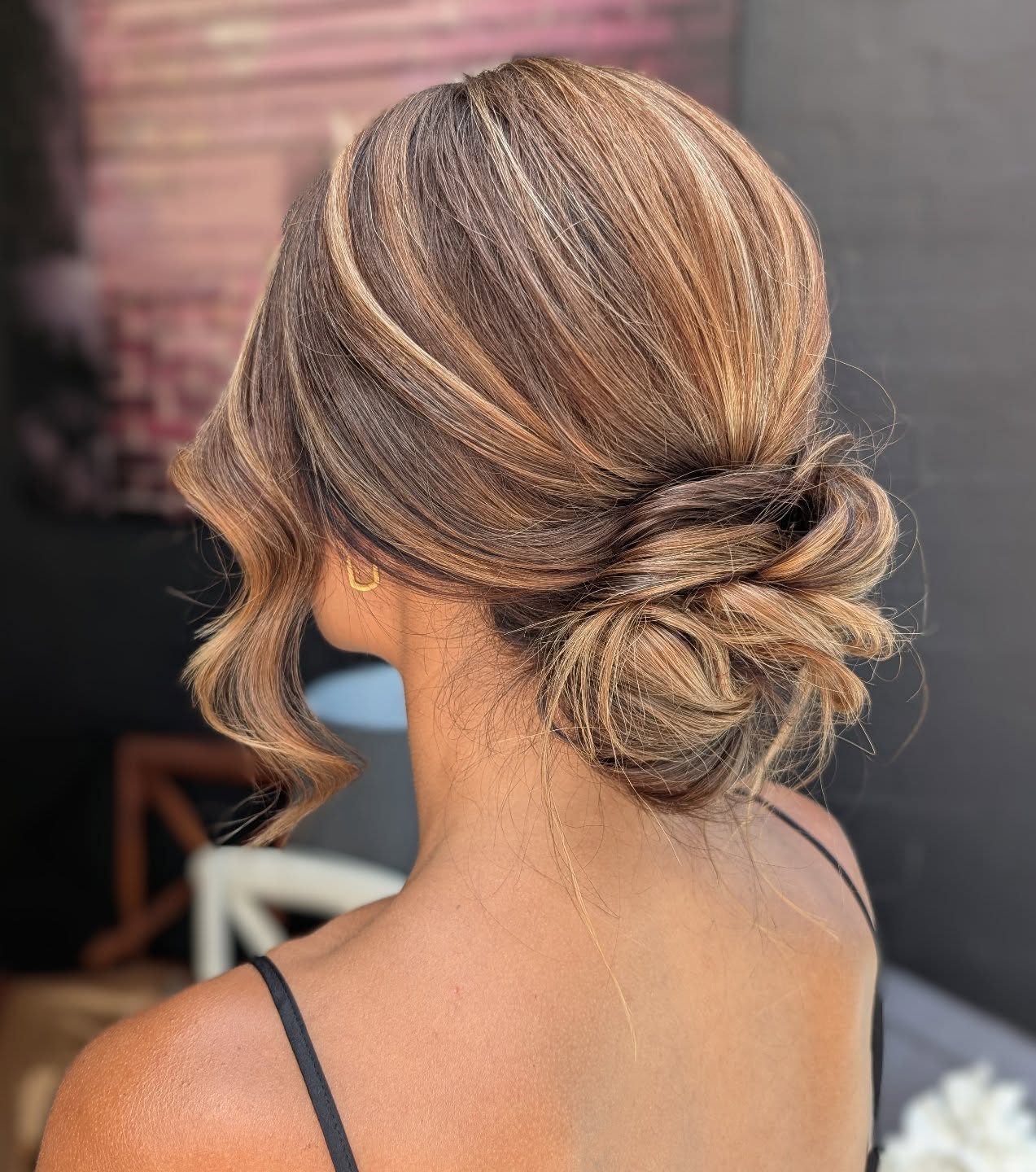 Twisted Low Bun with Soft Balayage Highlights