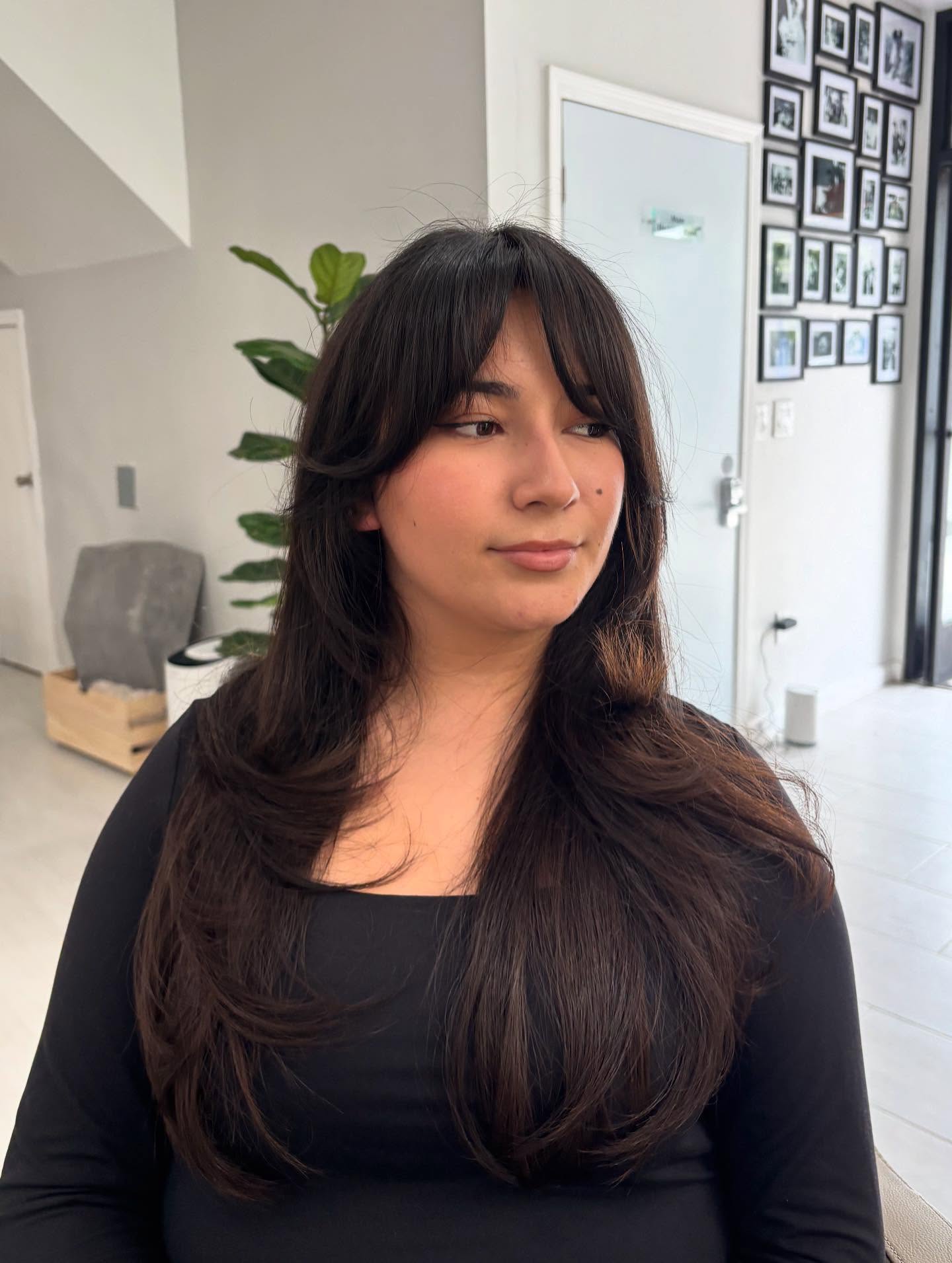 Voluminous Long Layers with Soft Wispy Bangs