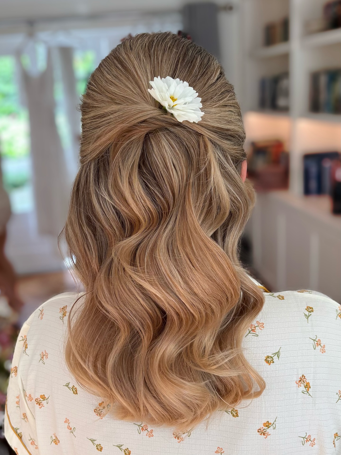 Charming Floral-Accented Waves in Half-Up Style