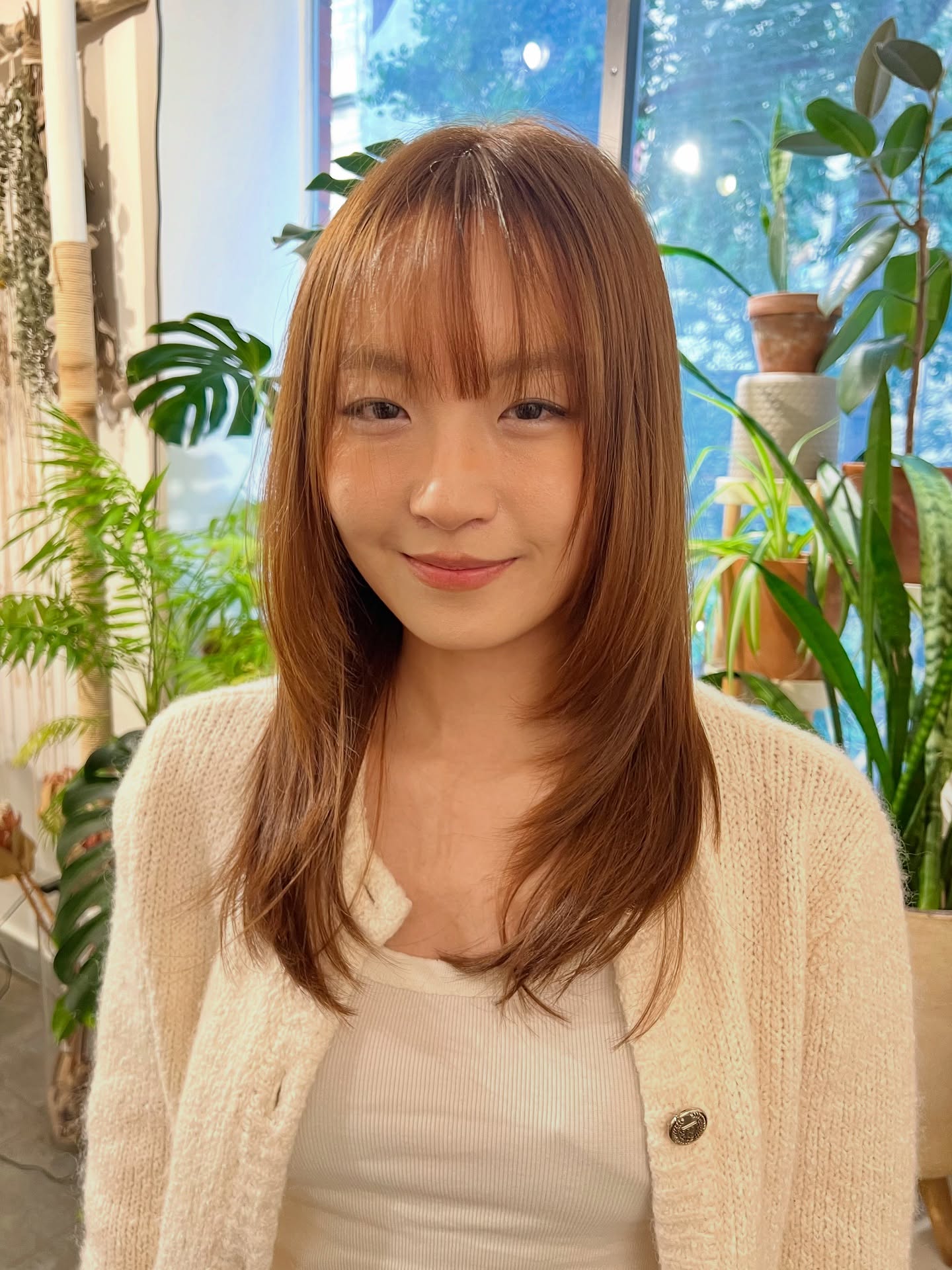 Chestnut Brown Bob with Subtle Highlights and Wispy Bangs