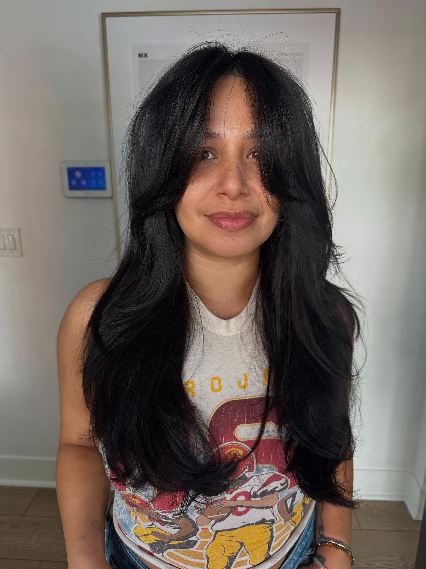 Chic Black Curtain Bangs with Tousled Layers