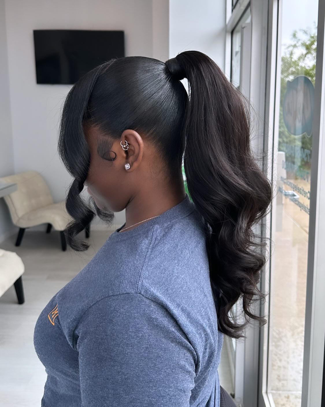 Chic High Ponytail with Soft Loose Curls