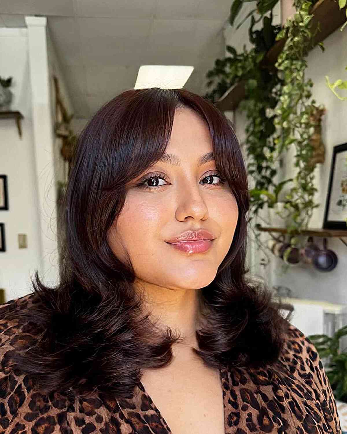 Chic Layered Haircut with Soft Bangs