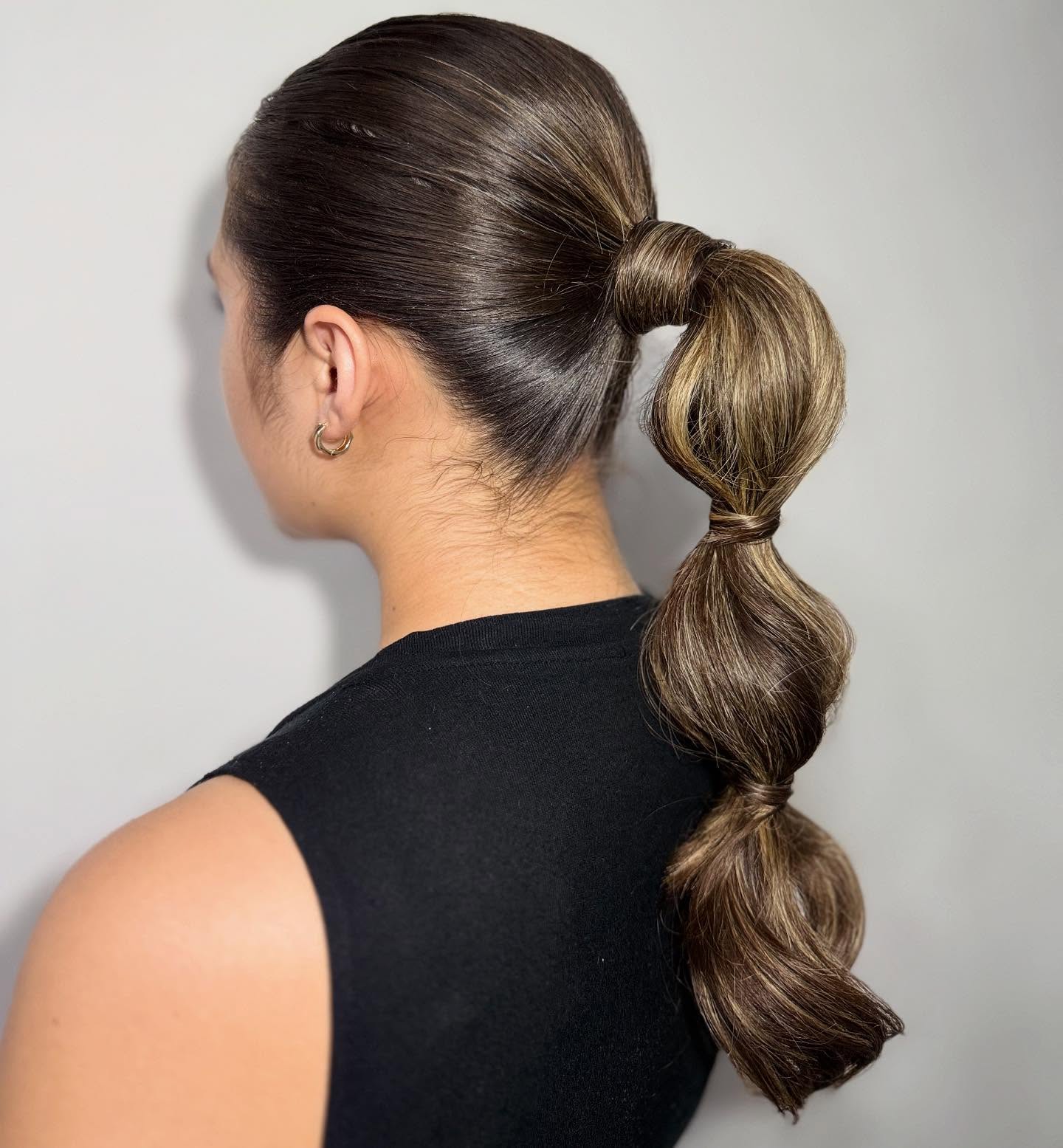 Chic Textured Long Hair Ponytail with Playful Spirals
